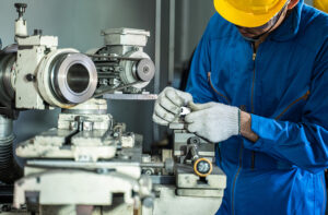 A picture of a millwright fabricating a machine part