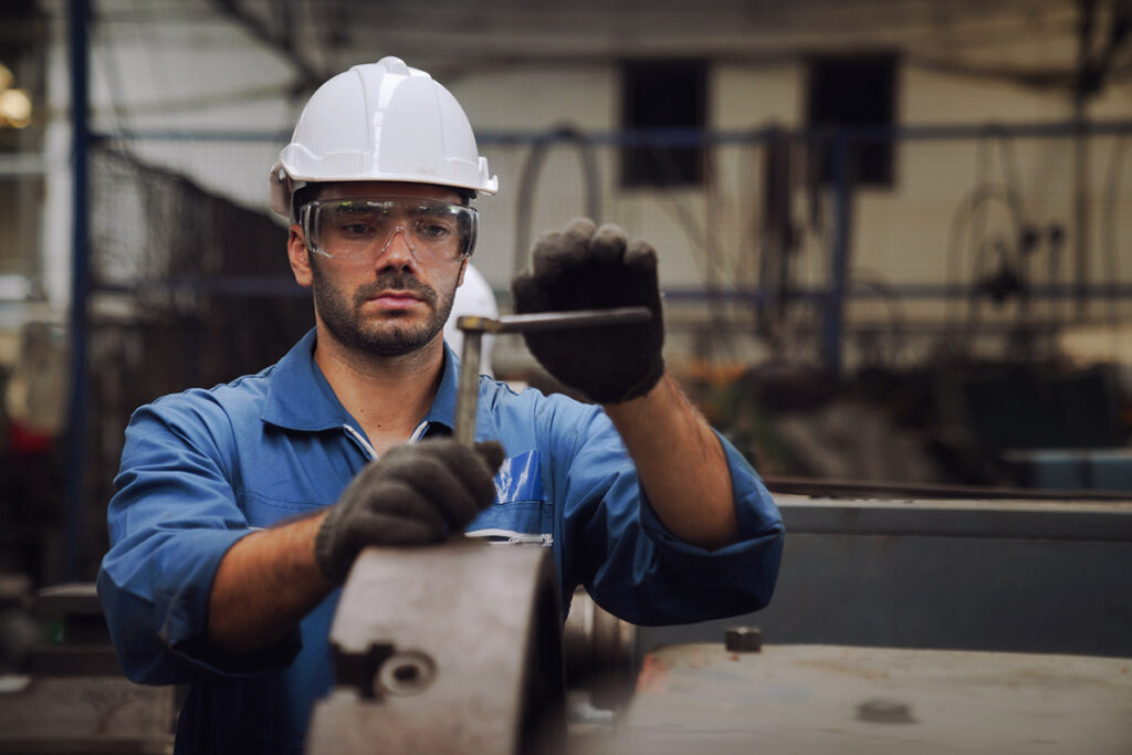 a millwright in Milton performing machine repairs